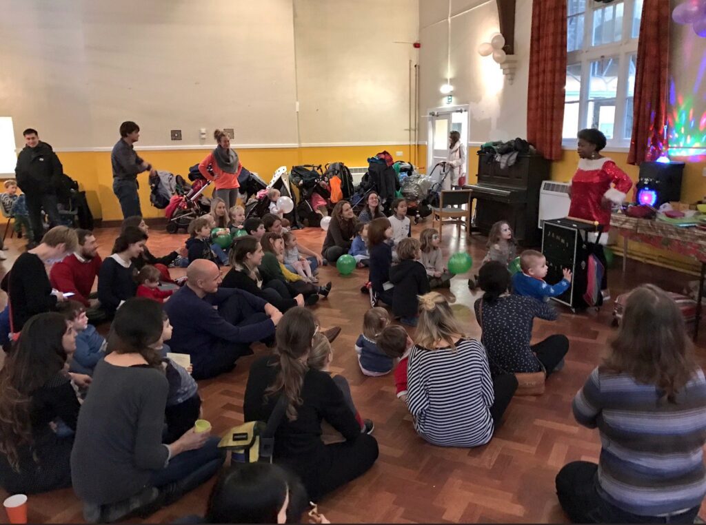 Children and parents watching a magic show